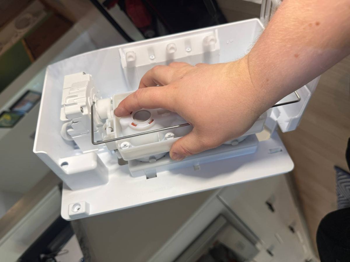 Ice maker assembly taken out of a refrigerator door for testing